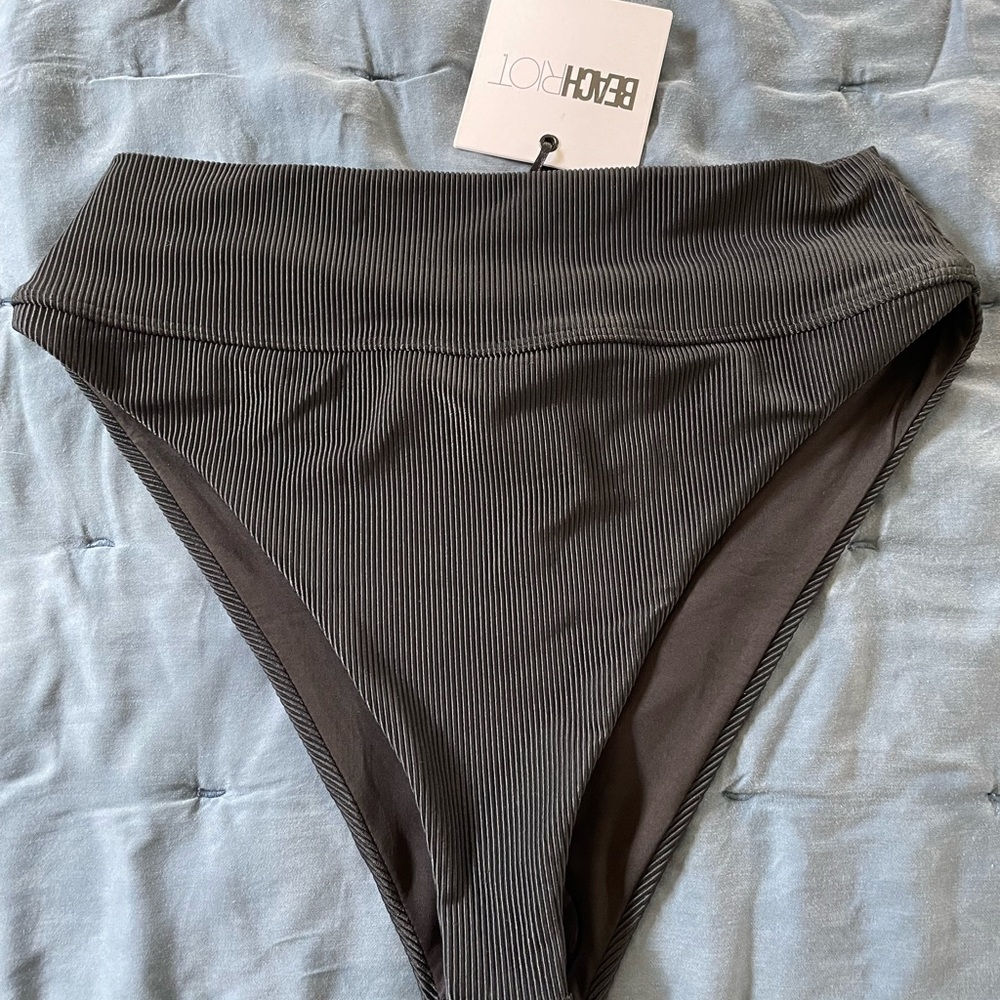 Large Black Beach Riot swim bottoms. NWT.